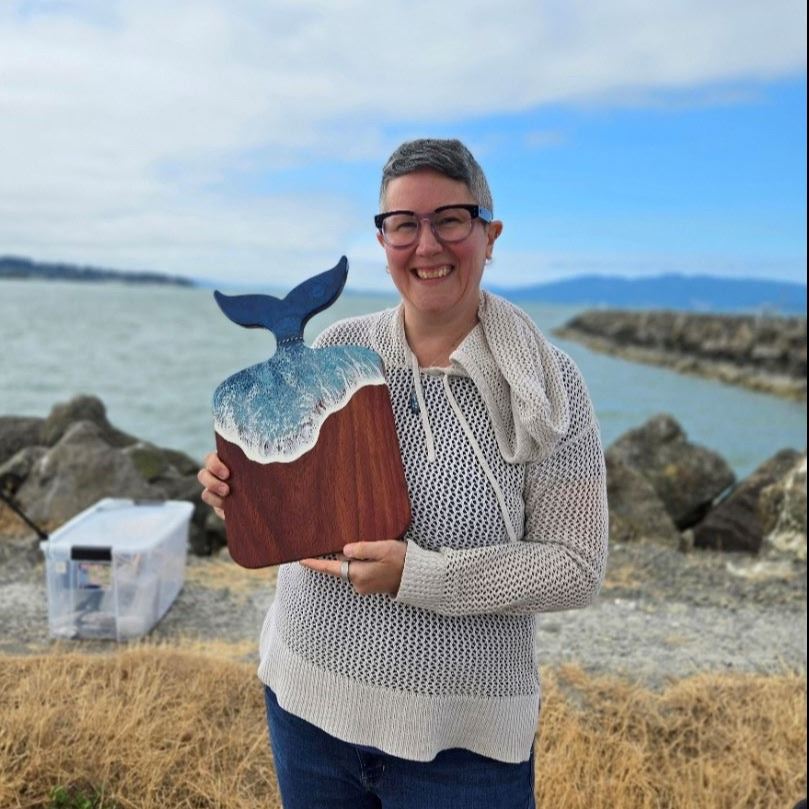 Jen from Rusted Element Design holding a board